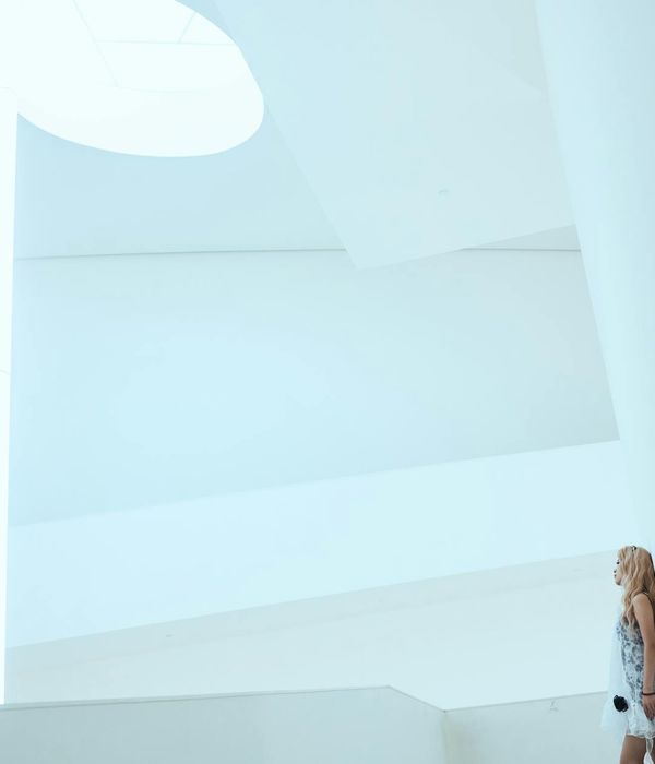 Woman feeling serene and balanced in a bright space.